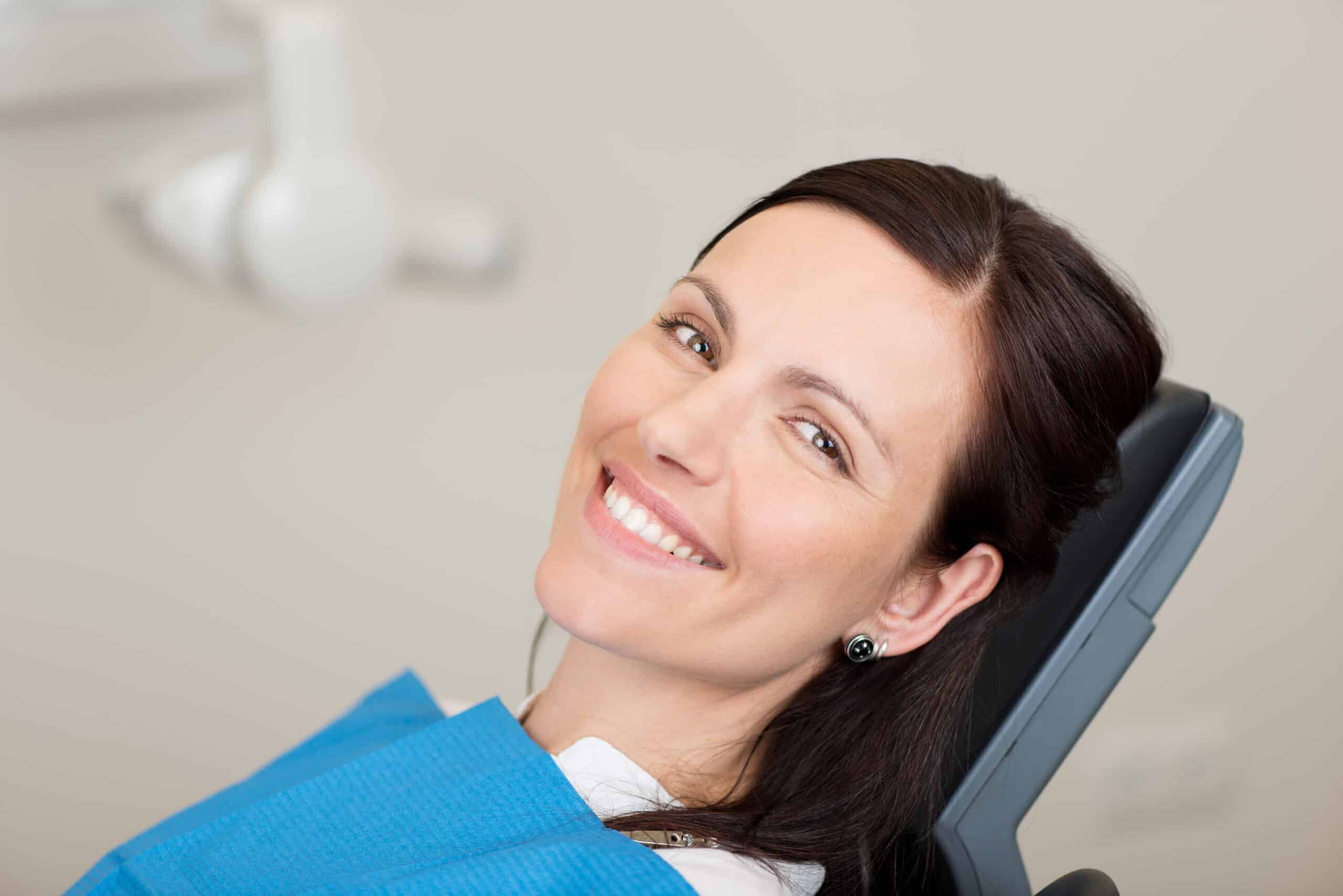Portrait,Of,Mid,Adult,Female,Patient,Smiling,In,Dentistry