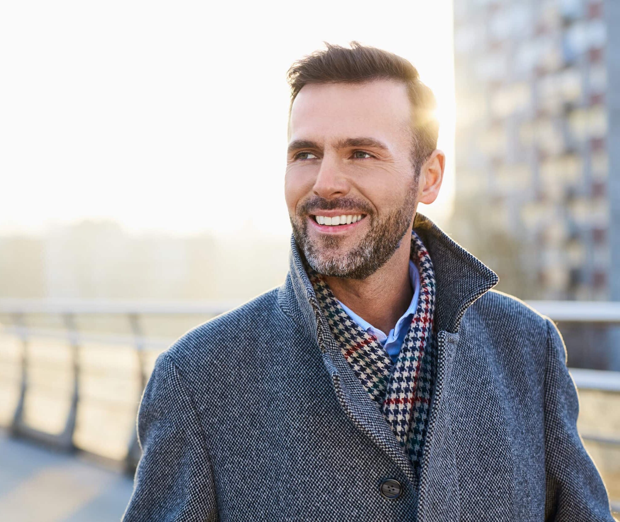 Happy,Man,Standing,Outdoors,During,Sunny,Winter,Day